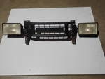 2000 Polaris Magnum 325 2WD Front Grill Bumper Headlight. Fixed Price $45.00.