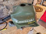 Kawasaki Prairie 360 11 Gas Tank Cover 14091-7525-286 54254. Fixed Price $55.00.