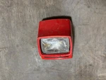 1983 Yamaha Tri-moto 200 Wheeler Headlight Assembly. Fixed Price $85.00.